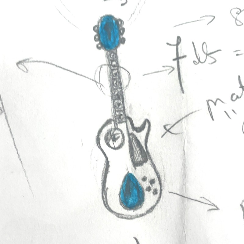 pendentif guitare électrique or blanc et diamant piece unique réaliser dans la région de Lyon