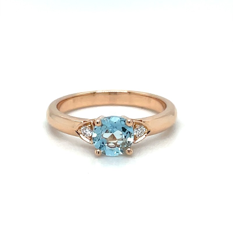 bague de fiançailles en or rose avec une aigue marine et des diamants 